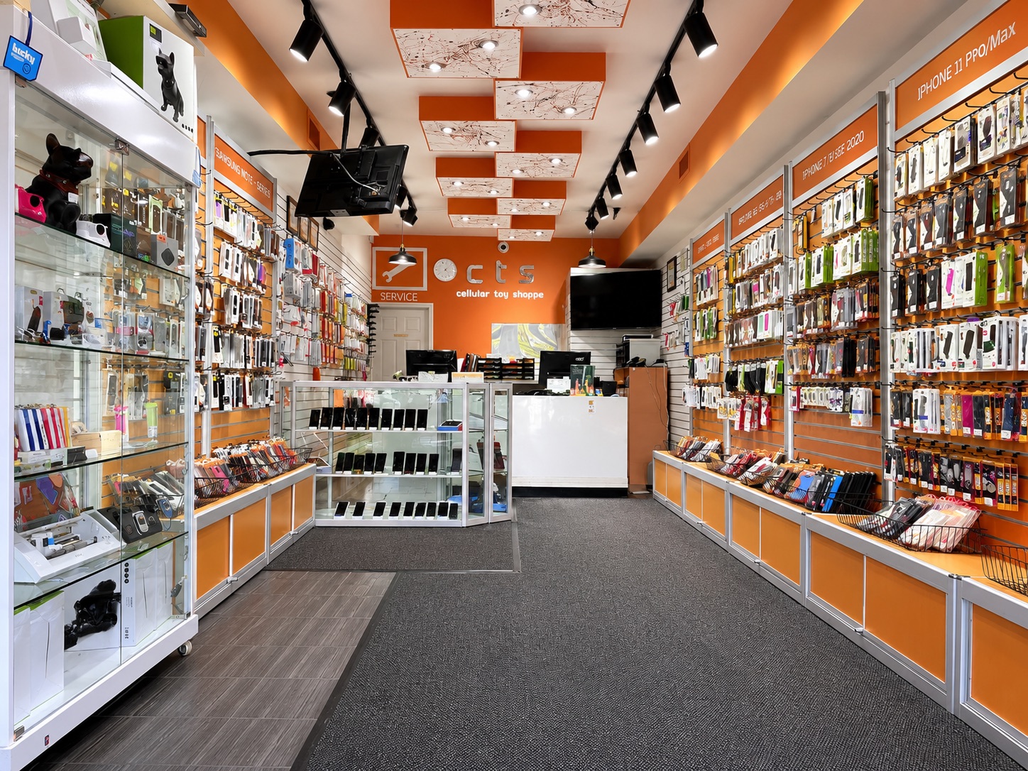 Inside Cellular Toy Shoppe — accessory wall and showroom